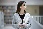 Thinking, university or woman with phone in library for research, communication or blog news. Social media, education or student on smartphone for scholarship networking, website or online content
