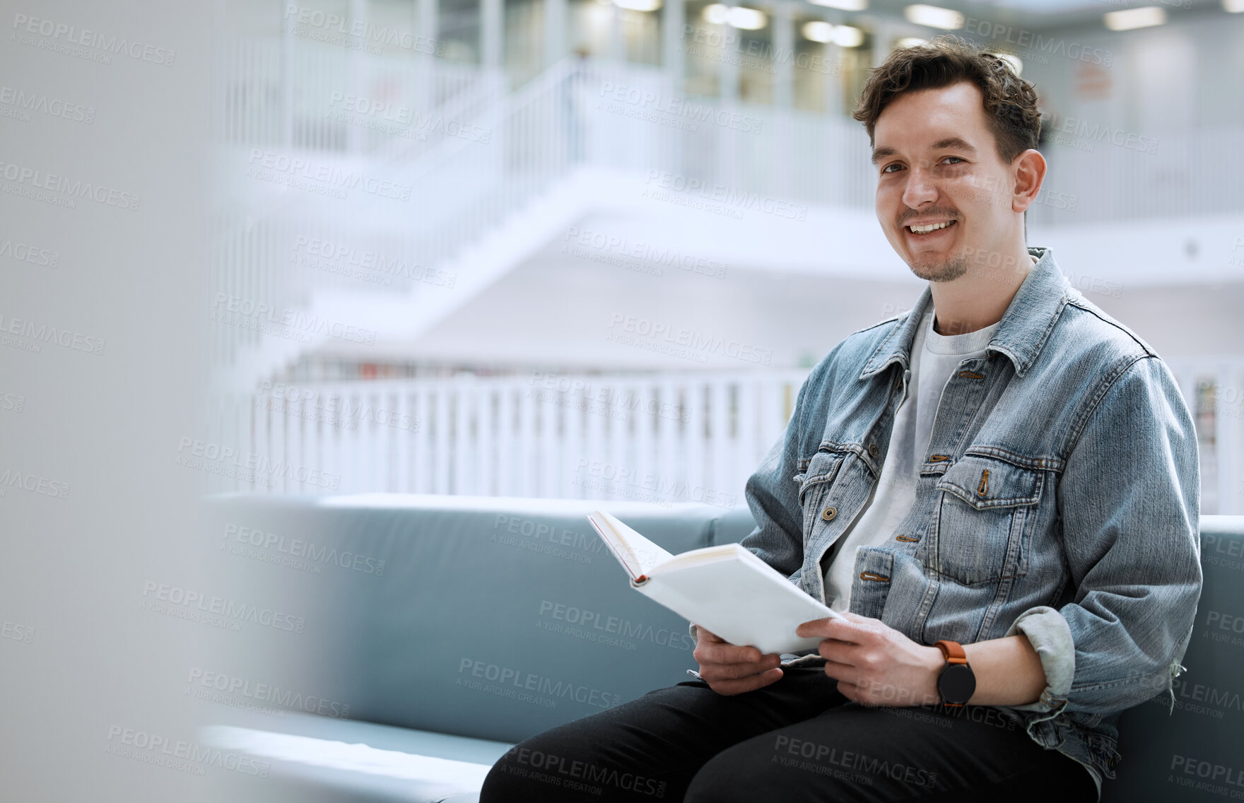 Buy stock photo Reading, books and happy man in library for university, college or research in portrait of philosophy scholarship. Student with English language, education or knowledge on history studying in college