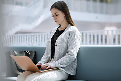 Buy stock photo Research, library or woman student on laptop for internet, communication or blog news in college lobby. Typing, digital or girl sitting on tech for networking, website search or online content review