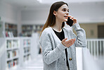 Woman, phone call and communication with technology and connection, virtual conversation with talking. Student at library, speaking on smartphone with contact for research and young person has chat