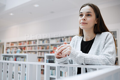 Buy stock photo University, thinking and woman in library for knowledge, learning and academic research in building. Education, college and young female student with ideas, vision and happy mindset for future goals