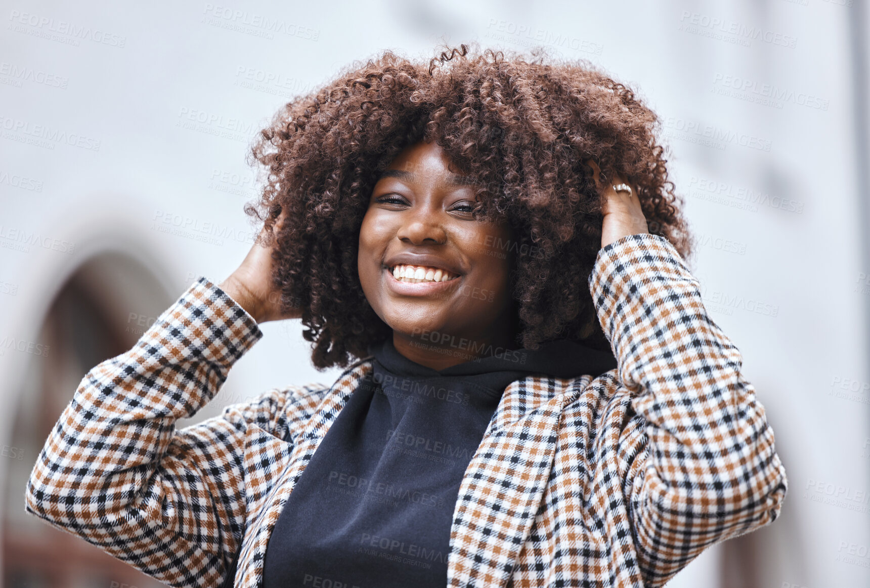 Buy stock photo Black woman, portrait smile and afro hairstyle for fashion in city travel, trip or outdoor journey. Happy African American female touching stylish curls and smiling in happiness for traveling in town