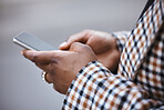 Closeup, black hands and smartphone for typing, outdoor and connection for social media, chatting and online reading. African woman, zoom and female with cellphone, city and communication with device