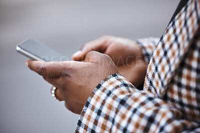 Buy stock photo Closeup, black hands and smartphone for typing, outdoor and connection for social media, chatting and online reading. African woman, zoom and female with cellphone, city and communication with device