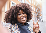 Selfie, peace sign and black woman portrait with a smile from travel in a urban city. Happy, young person and face of a African female on a holiday with freedom by a building with blurred background