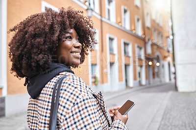 Buy stock photo Travel, smile and black woman in street with phone, holiday sightseeing in London, happy tourist walking in road. Vacation, urban adventure and relax, 5g on walk with buildings and explore new city.