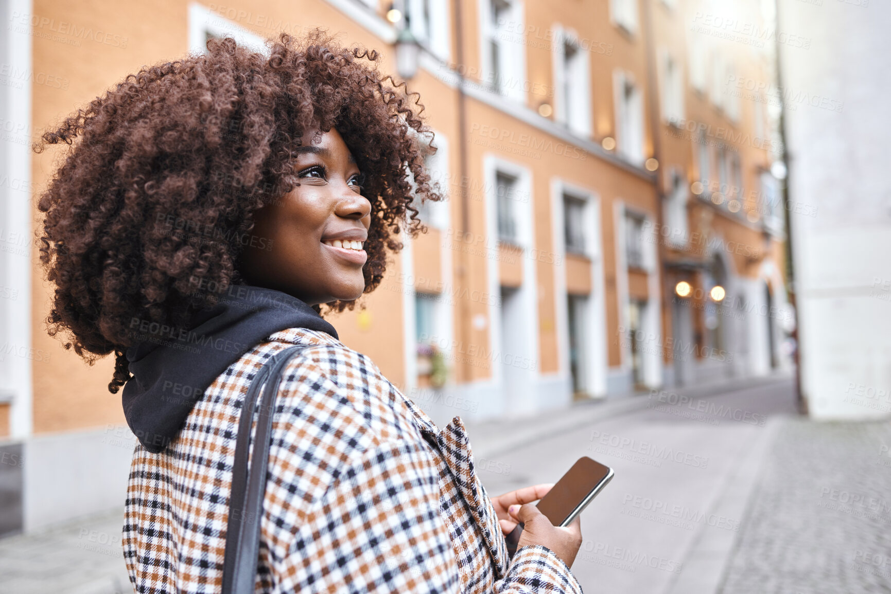 Buy stock photo Travel, smile and black woman in street with phone, holiday sightseeing in London, happy tourist walking in road. Vacation, urban adventure and relax, 5g on walk with buildings and explore new city.