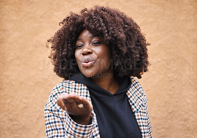 Buy stock photo Smile, flirt and black woman blowing a kiss for love and romance with urban fashion. Girl with hands, lips and kissing air, cute and fun celebration of romantic freedom and flirting with happy youth.