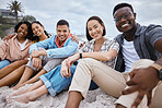 Friends, group and portrait at beach, sand and outdoor nature for fun, happiness and travel. Diversity of happy young people at sea, ocean holiday and vacation with smile of relaxing weekend together