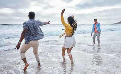 Buy stock photo Dance, water or crazy friends at a beach to relax on holiday vacation bonding in nature together in Bali. Funny, excited men and happy women group dancing at sea enjoy traveling on ocean trips 