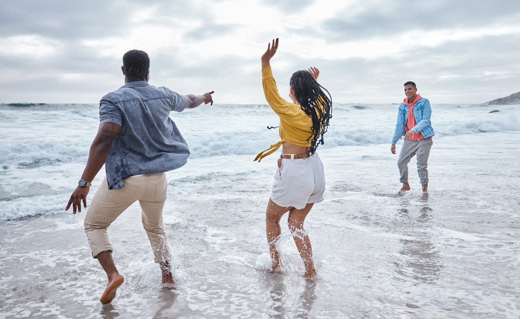Buy stock photo Dance, water or crazy friends at a beach to relax on holiday vacation bonding in nature together in Bali. Funny, excited men and happy women group dancing at sea enjoy traveling on ocean trips 