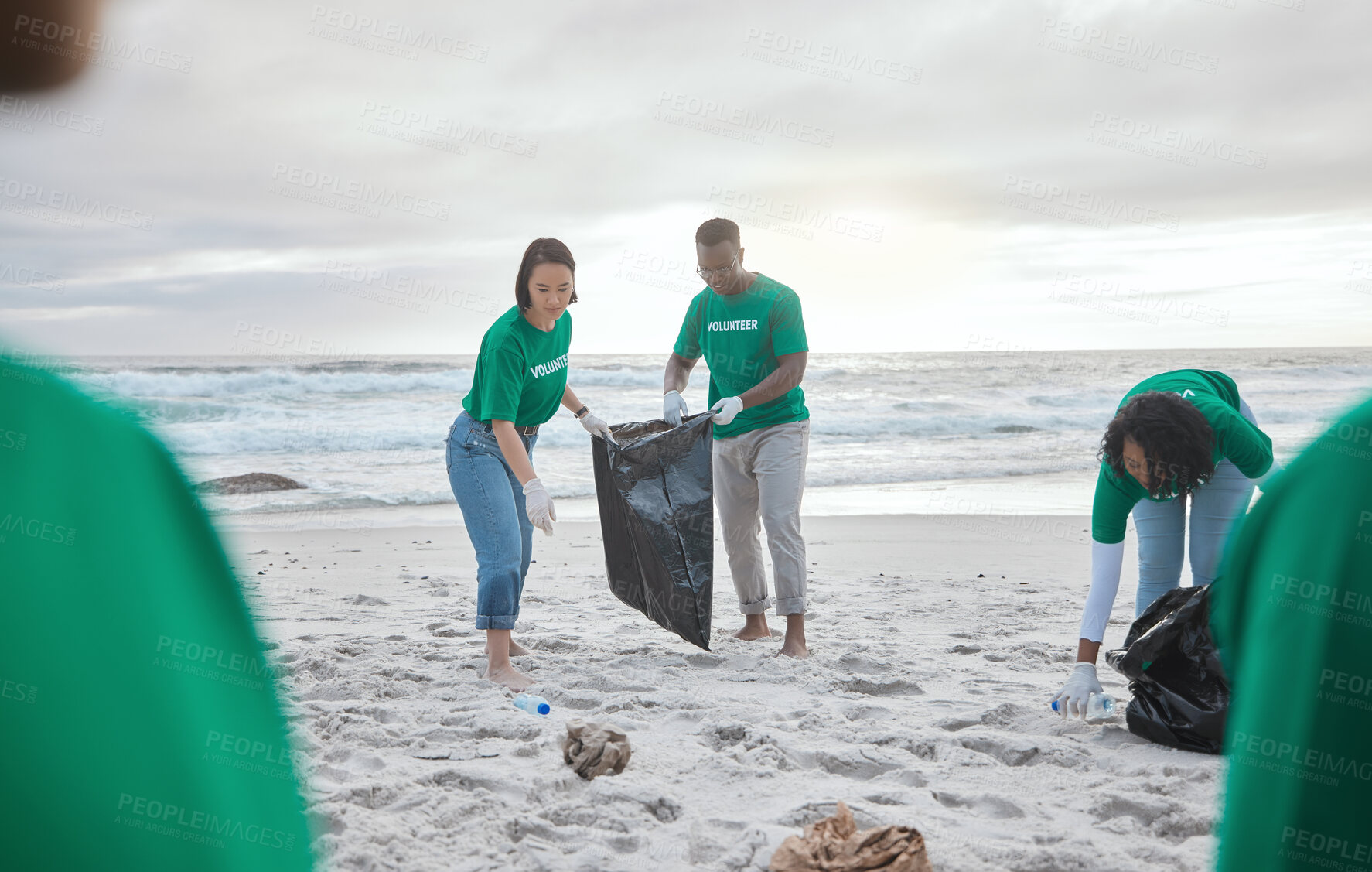 Buy stock photo Teamwork, charity and recycling with people on beach for sustainability, environment and eco friendly. Climate change, earth day and nature with volunteer and plastic for help, energy and pollution