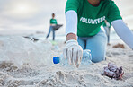 Hands, plastic and volunteer at beach cleaning for environmental sustainability. Recycle, earth day and woman or charity activist picking up bottle, trash and garbage for recycling to stop pollution.