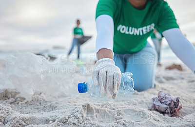 Buy stock photo Hands, plastic and volunteer at beach cleaning for environmental sustainability. Recycle, earth day and woman or charity activist picking up bottle, trash and garbage for recycling to stop pollution.