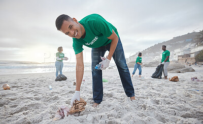 Buy stock photo Volunteer portrait, beach cleaning or man for recycling plastic bottle for community service, pollution and earth day. Smile, ngo team or sand trash for climate change, nature and helping environment