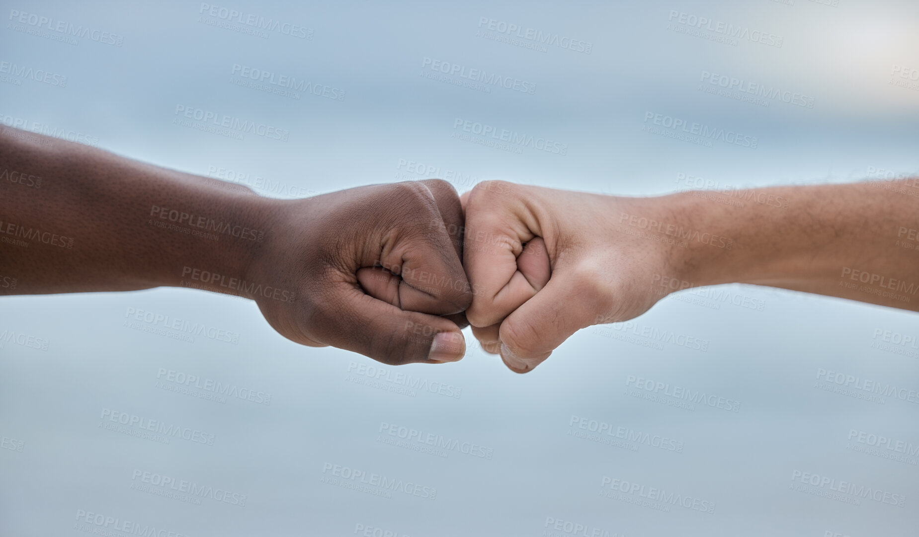 Buy stock photo Diversity, hands and fist bump on mockup for community, trust or unity on blurred background. Hand of people bumping fists in solidarity for deal, partnership or teamwork agreement, victory or win