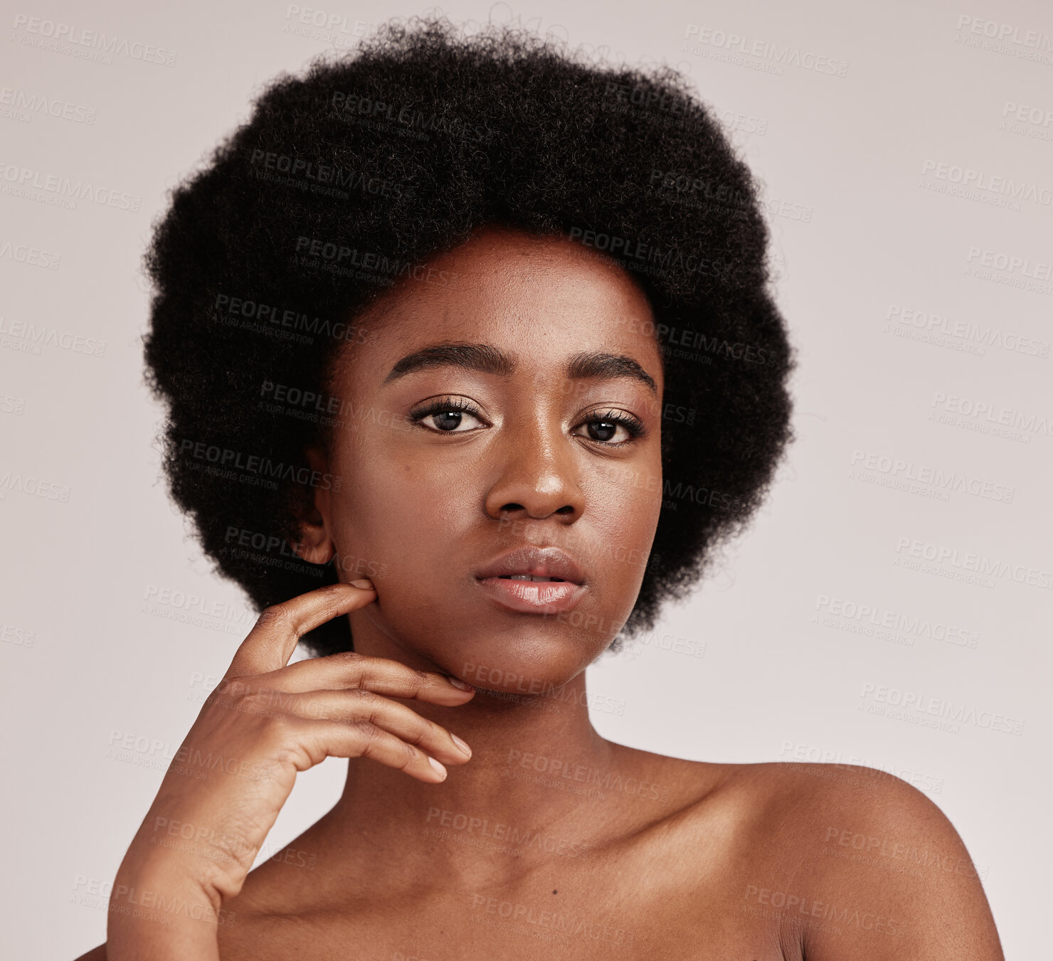 Buy stock photo Portrait, skin or natural and a model black woman in studio on a gray background with afro hair. Skincare, cosmetics and beauty with an attractive young female posing indoor for health or wellness