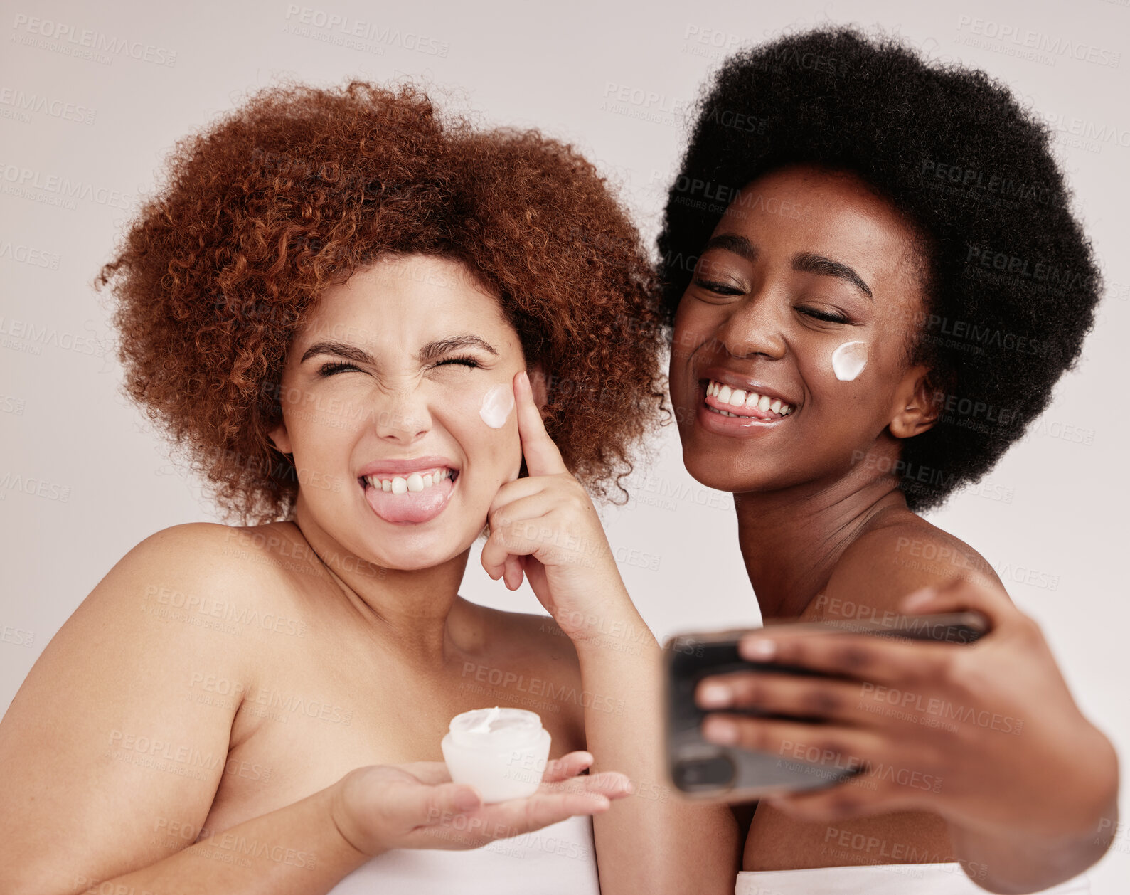 Buy stock photo Skincare, silly and cream with friends and selfie for product, facial and spa. Meme, phone and social media with black women and funny face with lotion for health, makeup and wellness in studio
