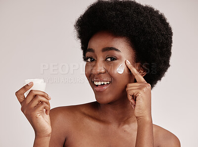 Buy stock photo Skincare, product and portrait of black woman with cream on face, smile and advertising skin care promotion. Dermatology, cosmetics and facial for happy model with jar isolated on studio background.