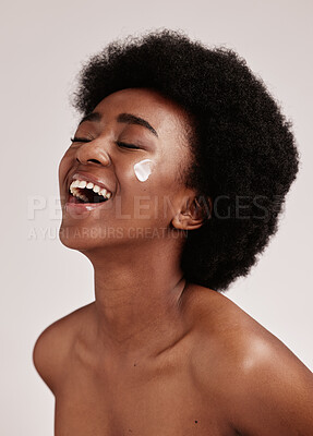 Beauty, smile and black woman with cream on face, afro and excited advertising for luxury skin product promotion. Dermatology, cosmetics and salon facial for happy model isolated on studio background