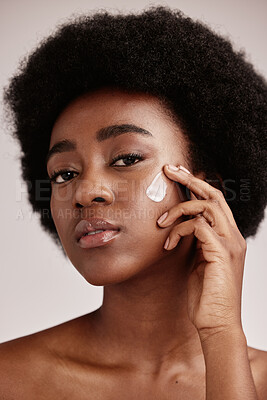 Buy stock photo Skincare, face and portrait of black woman with lotion, afro and advertising luxury skin care with collagen product promotion. Dermatology, cosmetic and facial for model isolated on studio background
