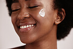 Dermatology, face shine and cream of a model with facial mask, skincare and sunscreen in studio. Isolated, white background and self care treatment of a young person with cosmetic and collagen lotion