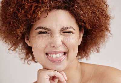 Buy stock photo Black woman face, wink and beauty with smile, funny facial expression with skincare and natural hair on studio background. Healthy skin, cosmetics and teeth, dermatology and wellness in portrait