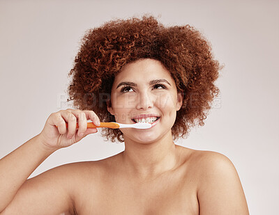 Buy stock photo Black woman, thinking and toothbrush in studio for cleaning, healthy mouth or hygiene by background. Happy gen z model, brushing teeth and smile for beauty, wellness and dental self care for health