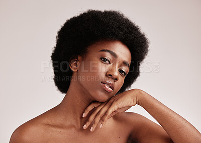Buy stock photo Portrait, beauty or skincare and a model black woman in studio on a gray background with afro hair. Skin, cosmetics and natural with an attractive young female posing indoor for health or wellness