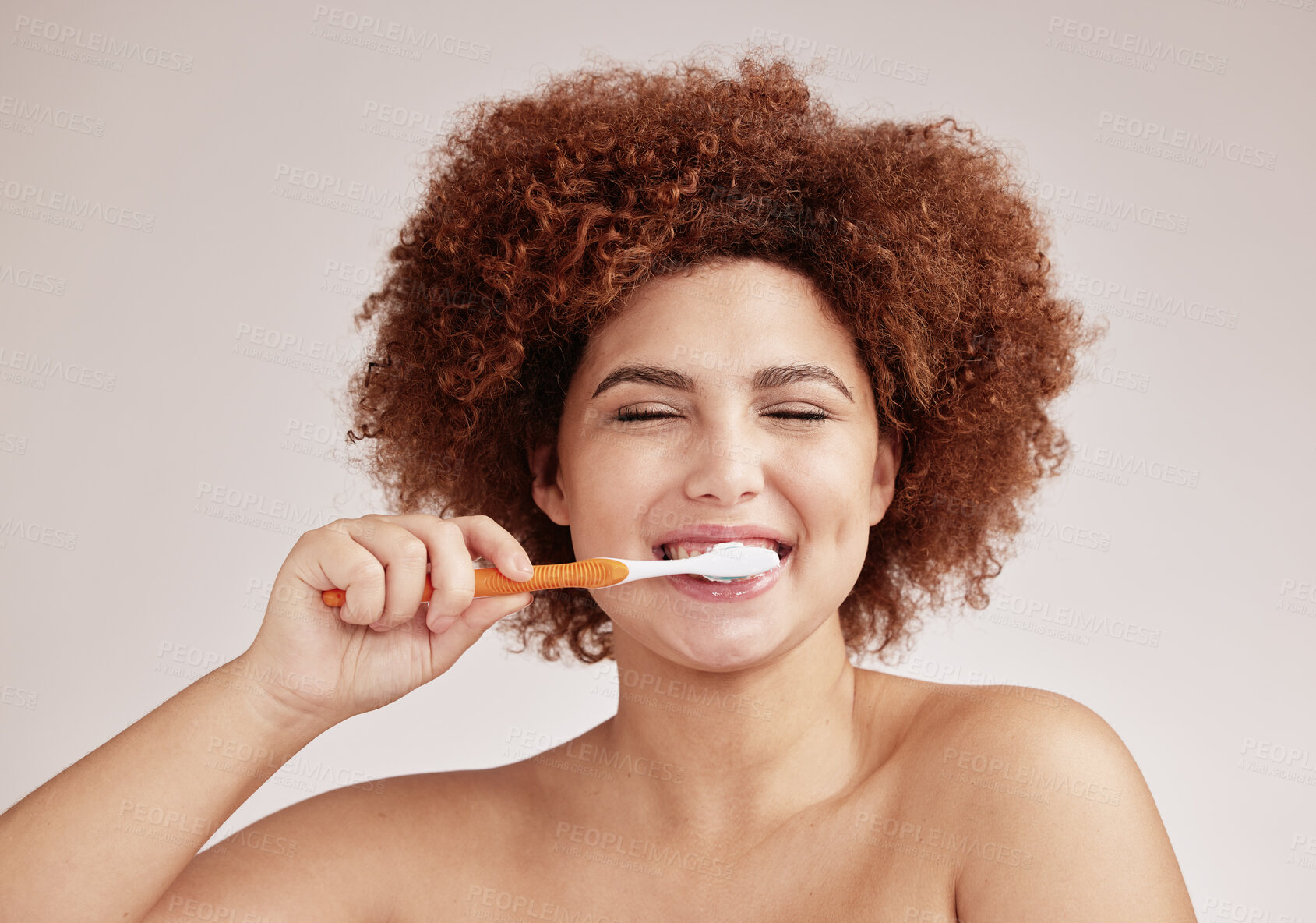 Buy stock photo Happy woman, brushing teeth and toothbrush for clean and healthy mouth on studio background. Face of person advertising dentist tips for dental care, hygiene and cleaning with a mint breath smile