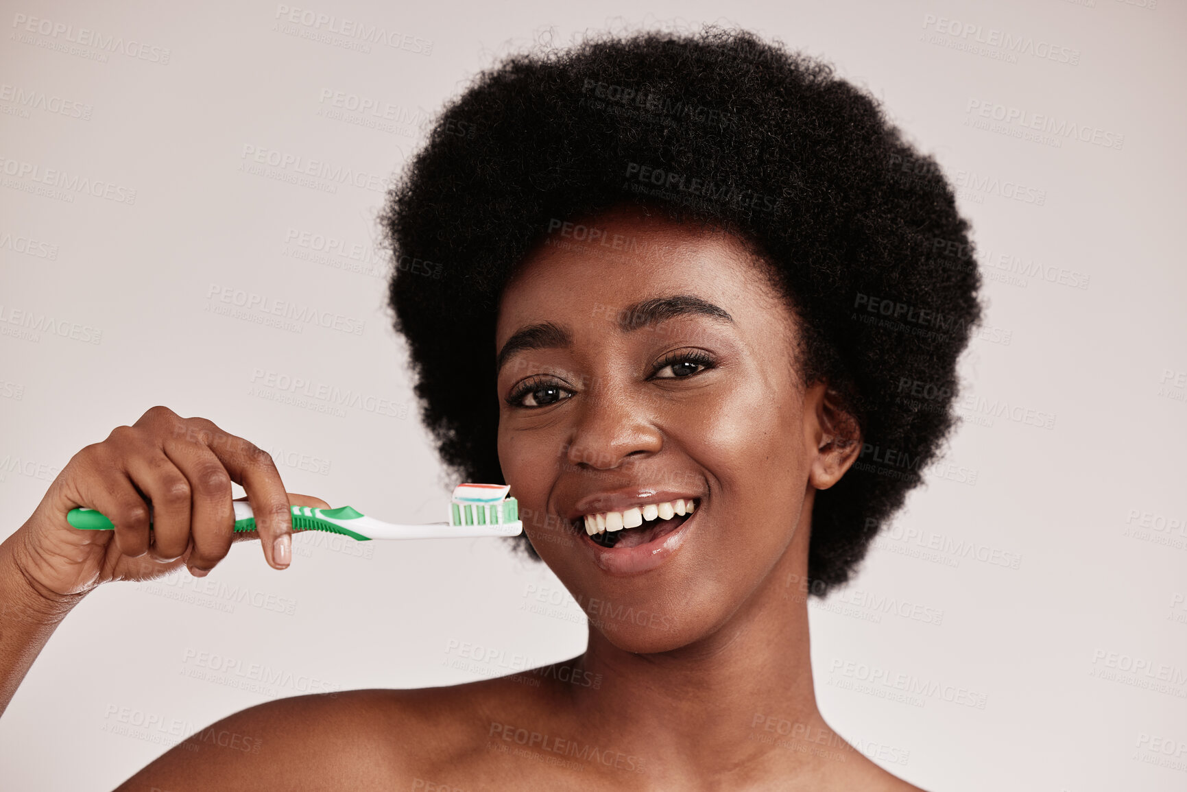 Buy stock photo Brushing teeth, black woman and toothbrush portrait for clean and healthy mouth on studio background. Face of happy person advertising dentist tips for dental care, hygiene and cleaning with a smile
