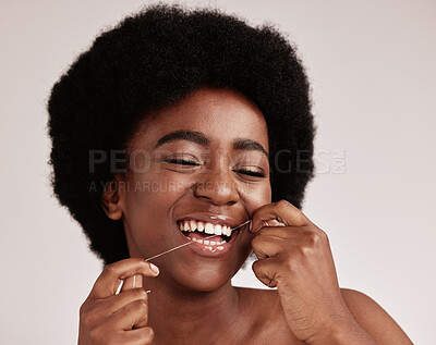 Buy stock photo Black woman, skincare or dental floss for teeth grooming, healthcare wellness hygiene or gum disease prevention. Smile, happy or flossing beauty model with afro hair, mouth cleaning or tooth product