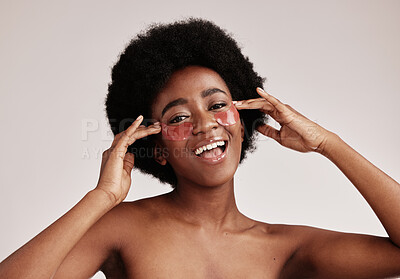 Buy stock photo Skin care, eye and face mask on black woman in studio happy with dermatology cosmetic product. Aesthetic model with hands for collagen patch for health, wellness and facial skin glow grey background