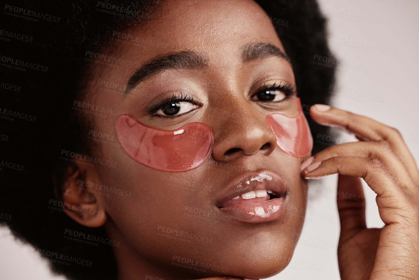 Buy stock photo Eye, skincare and face mask portrait on black woman in studio with dermatology cosmetic product. Aesthetic model with collagen patch for health, wellness and natural facial beauty on grey background