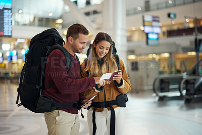 Buy stock photo Love, couple and in airport with passport, traveling and check passport for information, airline and summer vacation. Romance, man and woman with happiness, holiday and confirm travel time and break