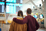 Couple at airport, travel and flight time for vacation overseas,
adventure and love with romantic getaway and back view. Man, woman with international holiday and ready to board airplane for flight