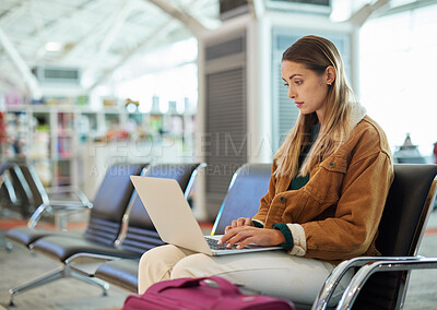 Buy stock photo Airport, travel and woman typing on laptop in lobby, social media or internet browsing. Immigration, freelancer and female with computer for networking, web scrolling and waiting for flight departure