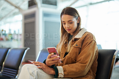 Buy stock photo Travel, phone and woman relax at airport lobby on social media, internet browsing or web scrolling. Immigration, mobile technology and female with smartphone for networking while waiting for flight.