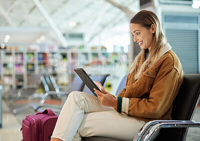 Buy stock photo Tablet, travel and woman relax in airport lobby, social media or internet browsing. Immigration, technology and female with touchscreen for networking, web scrolling and waiting for flight departure.