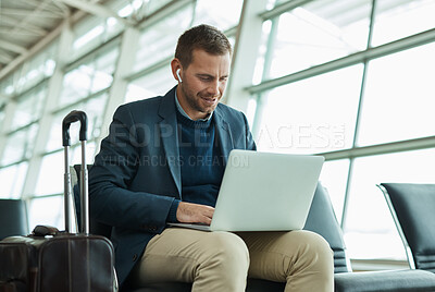 Buy stock photo Airport, business man and laptop for music during travel or working in lobby streaming internet. Entrepreneur person with luggage in building for video call while typing email, search or news