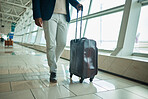 Airport legs, travel and man walking to airplane, flight booking or transportation for corporate trip. Luggage suitcase, plane departure or African businessman on holiday, vacation or global journey