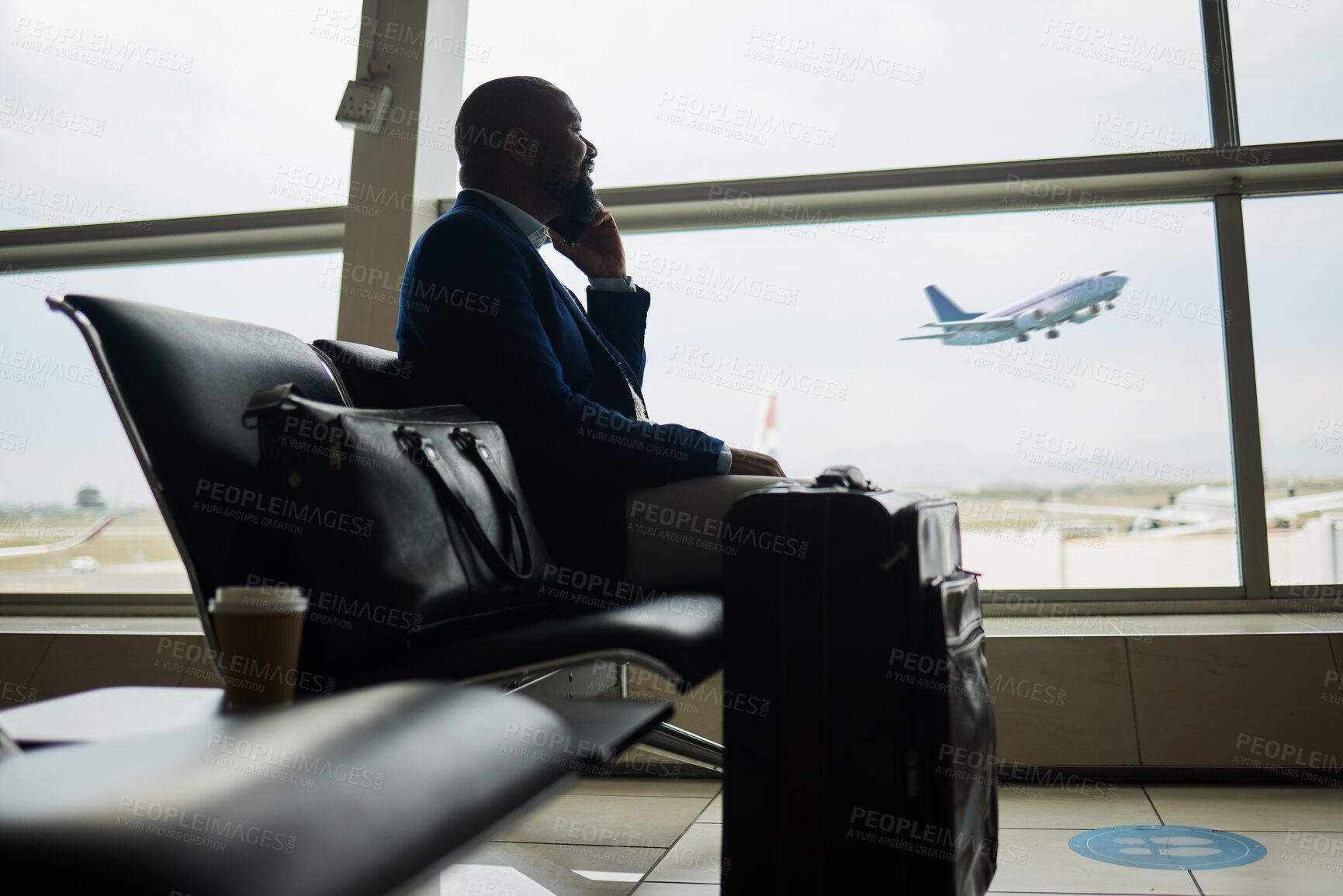 Buy stock photo Black man, phone call and luggage at airport for business travel, trip or communication waiting for flight. African American male in conversation or discussion on smartphone ready to board airplane