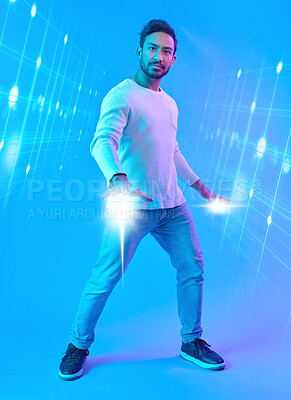 Buy stock photo Hologram, metaverse and portrait of a man in a studio with a cyber, digital or scifi overlay for gaming. Virtual reality, futuristic and male gamer with a 3d fantasy experience by a blue background.
