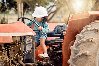Buy stock photo Girl child in tractor, agriculture and farming transport, sustainability and learning field work with development and fun. Childhood, farm machinery and farmer in training with growth and young kid