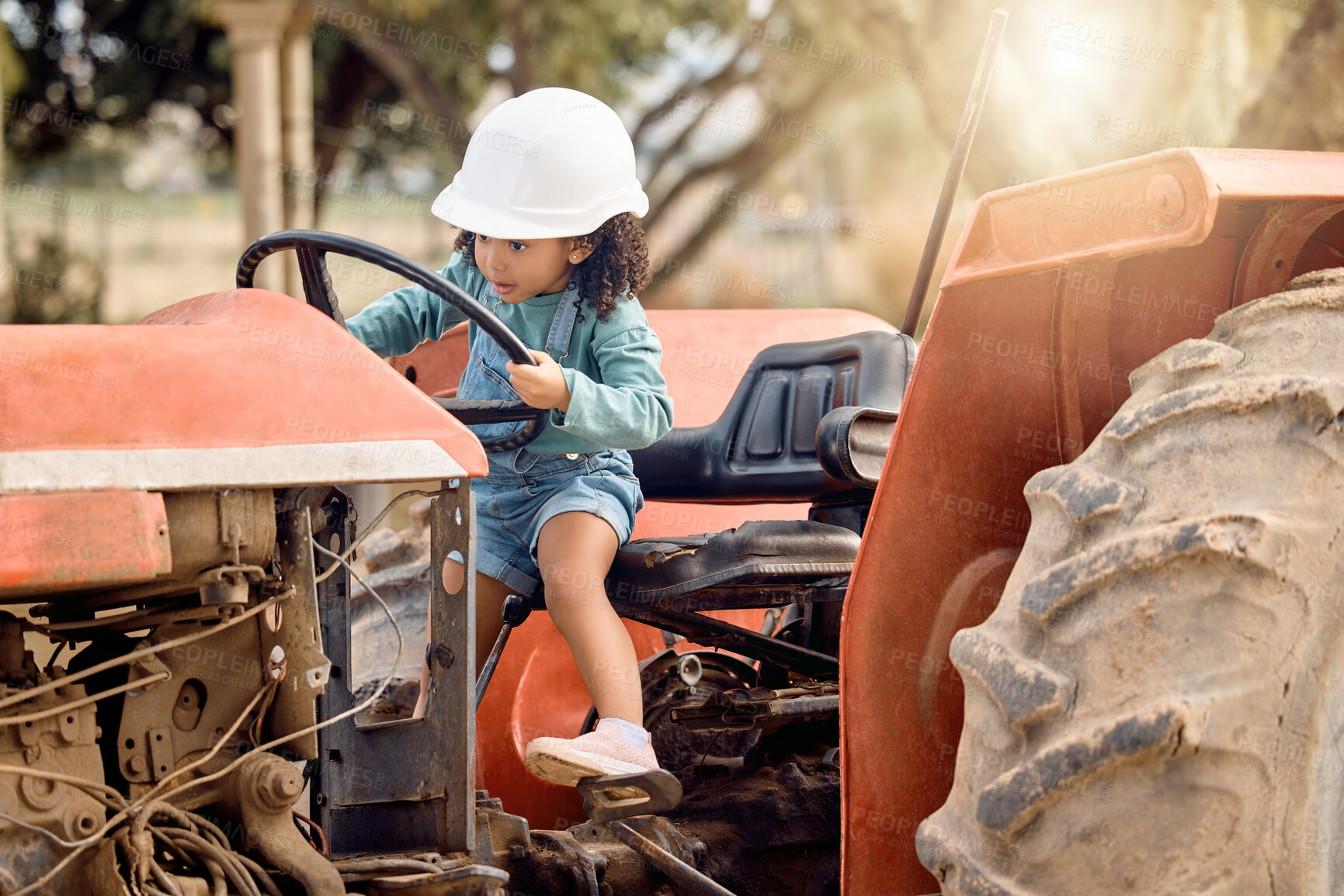 Buy stock photo Girl child in tractor, agriculture and farming transport, sustainability and learning field work with development and fun. Childhood, farm machinery and farmer in training with growth and young kid