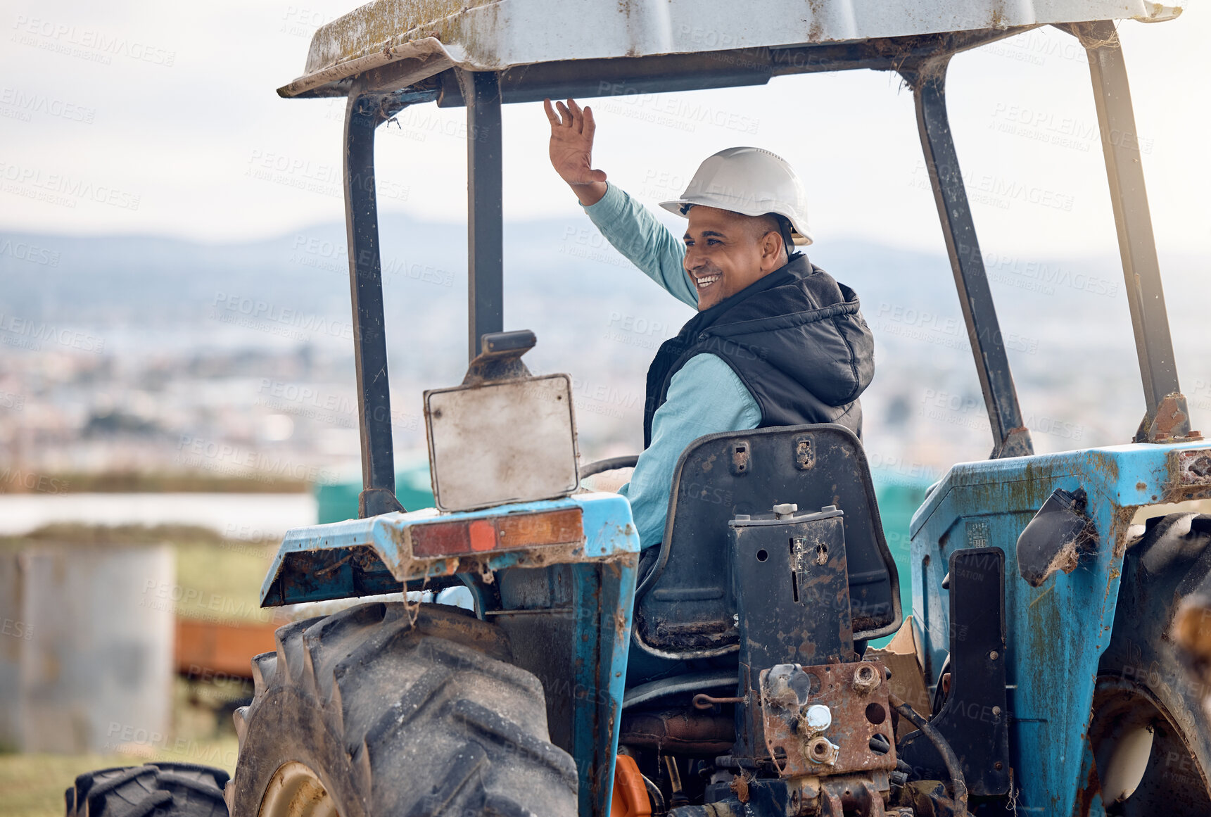 Buy stock photo Wave, greeting and man on a tractor for farming, agriculture work and working on a field in Spain. Happy, communication and farmer driving machine and waving for ecology and sustainability in nature