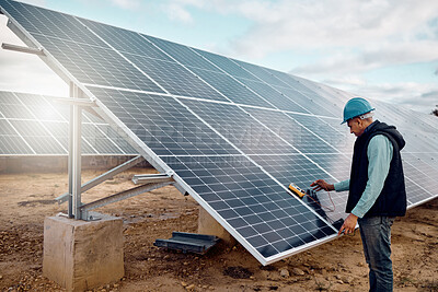 Buy stock photo Renewable energy, solar panel and senior construction worker outdoor working on grid. Industrial engineer, sustainability and eco friendly development of a mature engineering employee and handyman