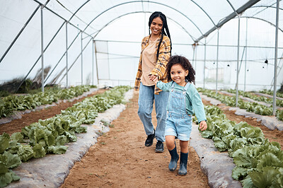 Buy stock photo Agriculture, greenhouse and mother walking with girl for gardening, farming and harvest vegetables together. Black family, nature and happy child with mom on farm for growing plants, food and produce