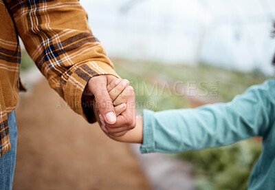 Buy stock photo Holding hands, family and children on a farm for agriculture or sustainability in a greenhouse for crop growth. Hand, love or kids with a mother and daughter walking together in the countryside
