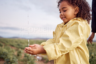 Buy stock photo Kid, child and young girl washing hands for hygiene and sustainability in nature on a farm in winter. Water and splash outdoor by rinsing and cleaning hand for eco friendly or natural sanitation